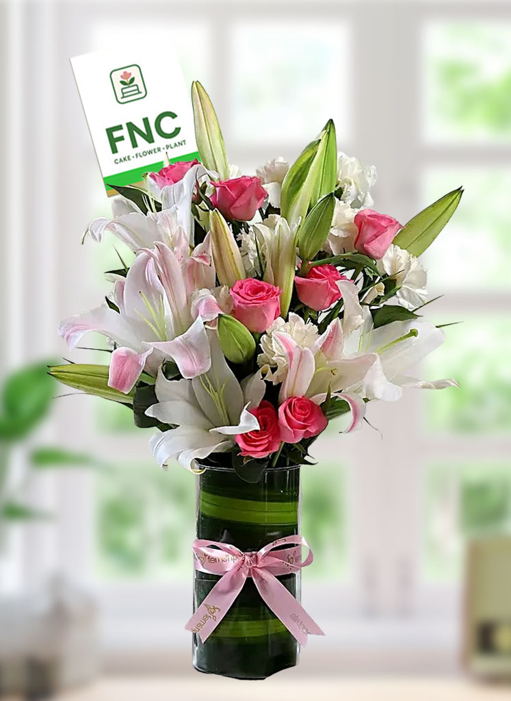 exotic-lily-in-vase Exotic Lily with vase arrangement - Image 1